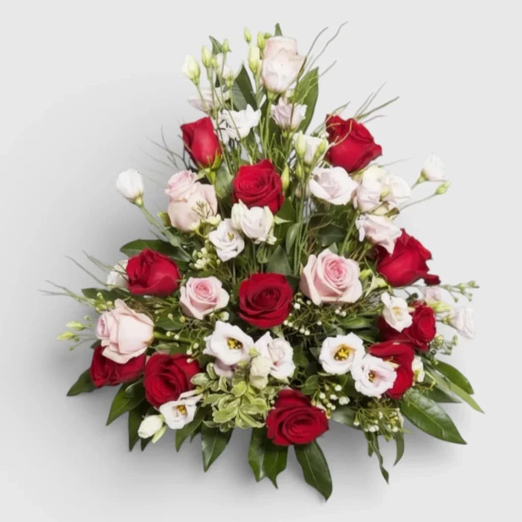 Flower arrangement of red and pink roses