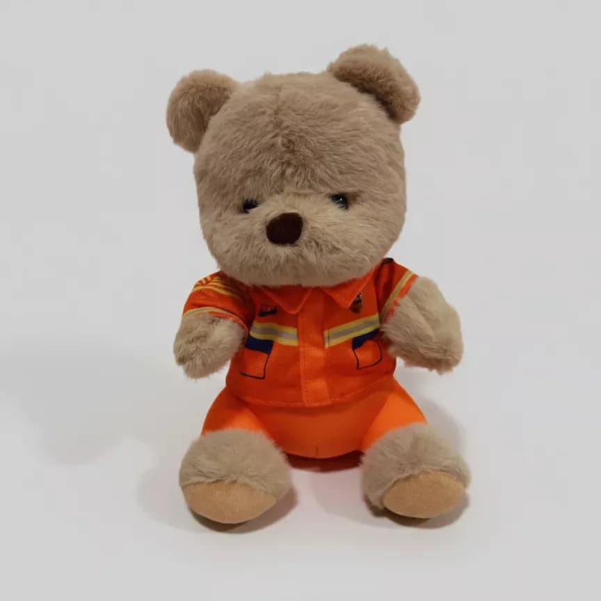 Soft toy teddy bear in a suit, brown