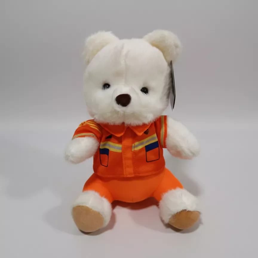 Soft toy teddy bear in a suit, white